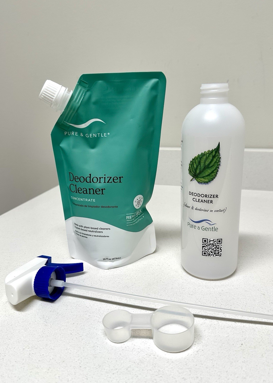 Pure & Gentle Deodorizer Cleaner Concentrate 16oz & spray bottle, and scoop.