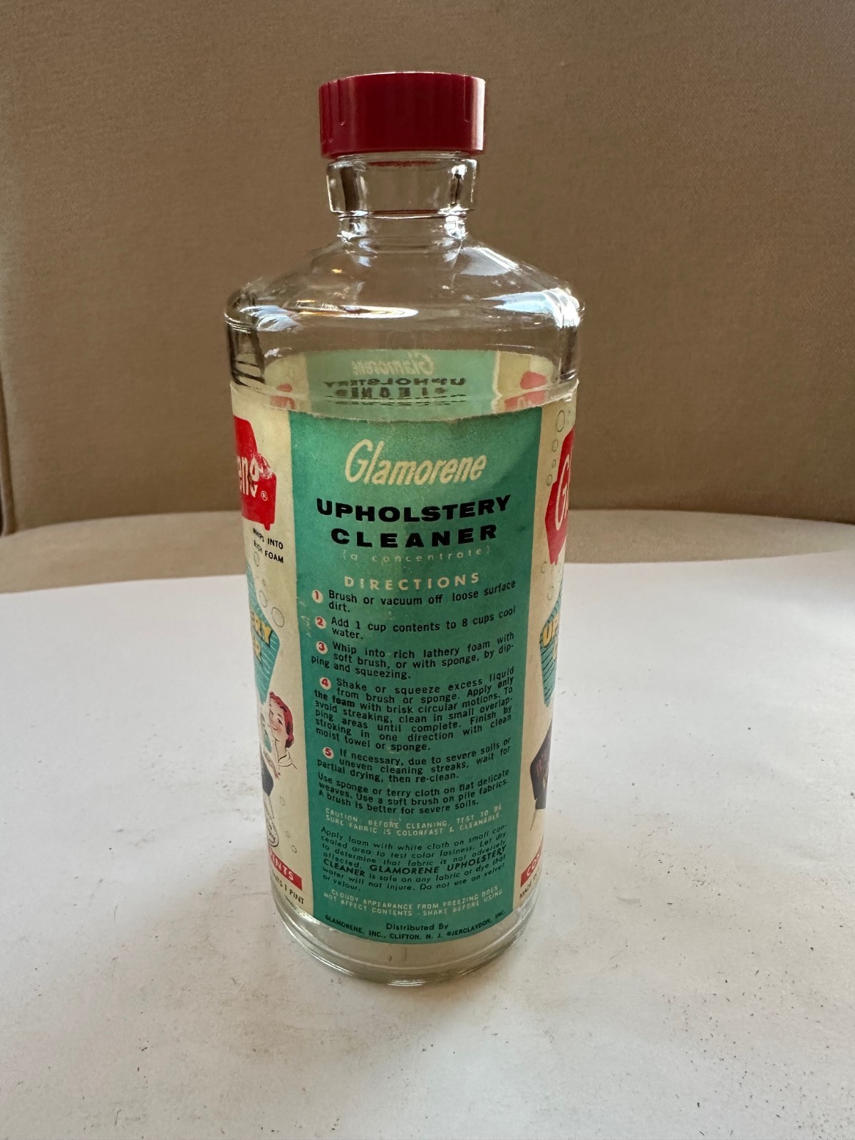 Vintage Glamorene Upholstery Cleaner One Pint Bottle With Lid. No contents.